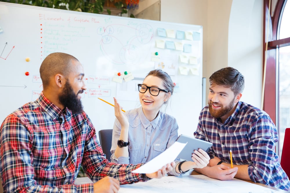 Multiethnic group of happy business people working together in office