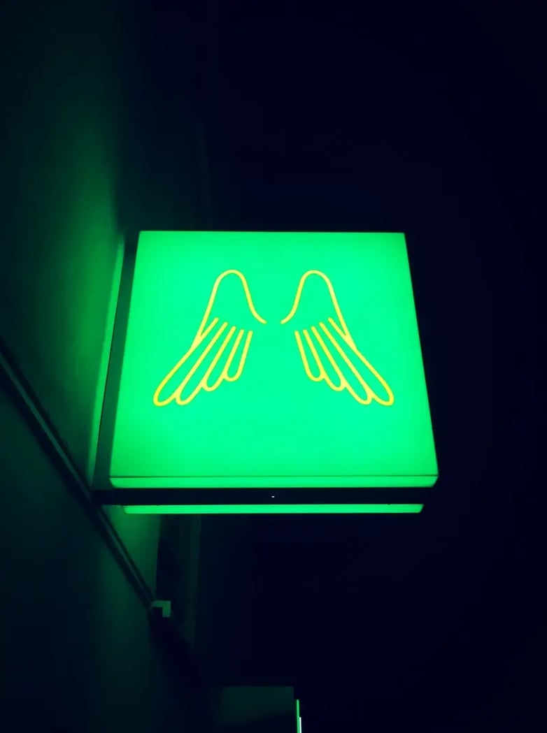 Where to hang an angel shot sign