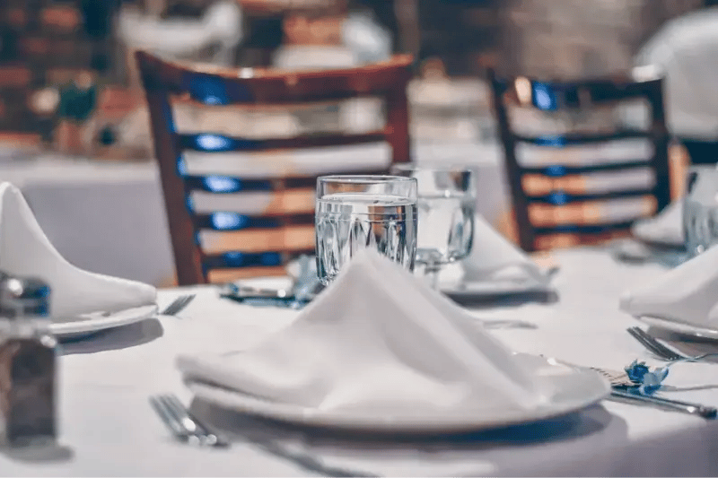 Prepare formal table settings to improve fine dining service